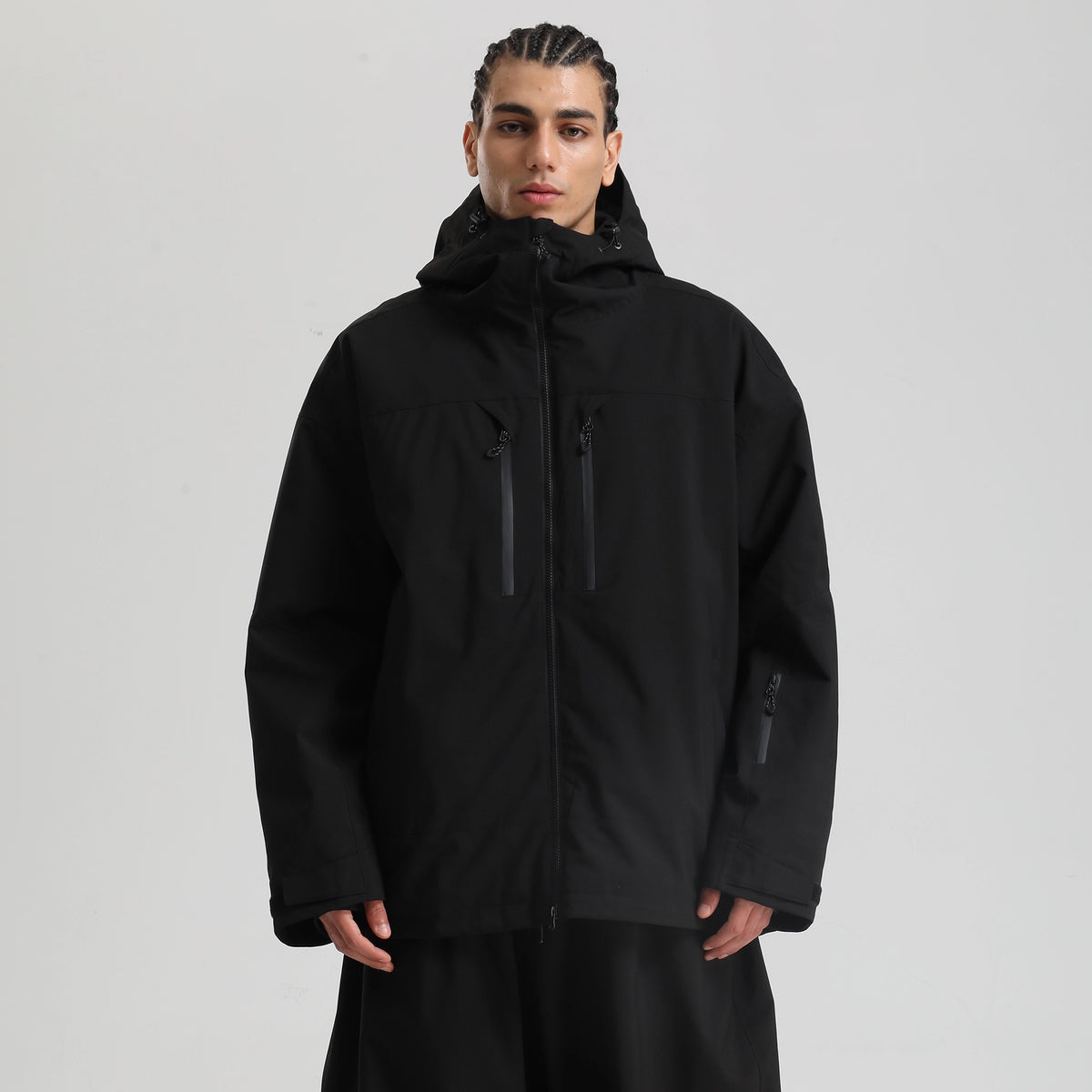Core 2L Insulated Ski Jacket in black, model front view with hood up and two chest zip pockets