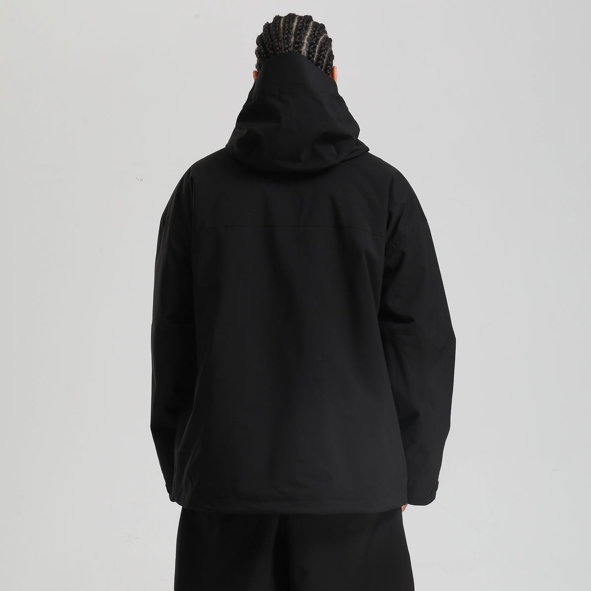 Core 2L Insulated Ski Jacket in black, model back view showing the hood